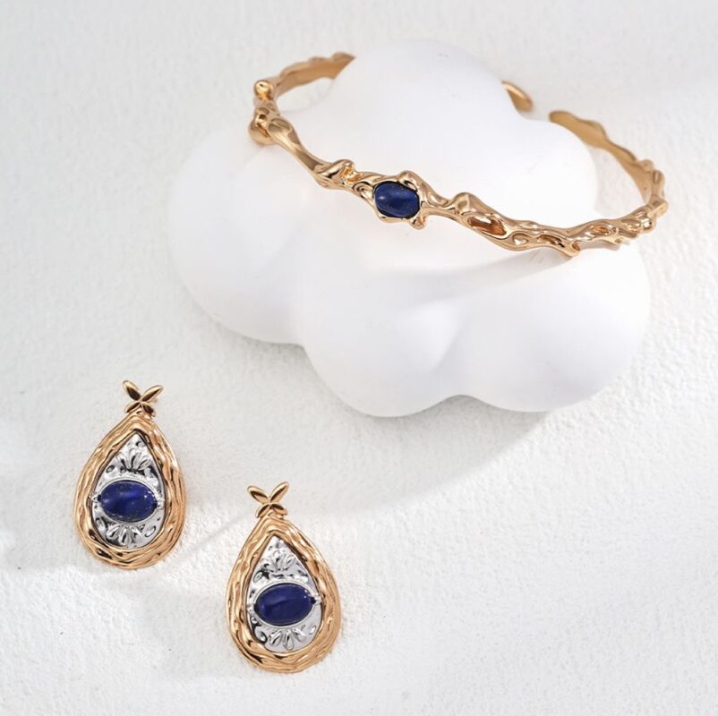 Modern lapis lazuli ring and pendant in sterling silver and gold.