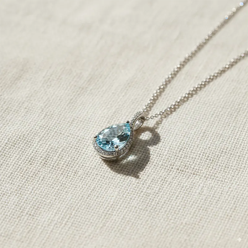 March birthstone jewelry, aquamarine gemstone pendant in white gold for courage and serenity